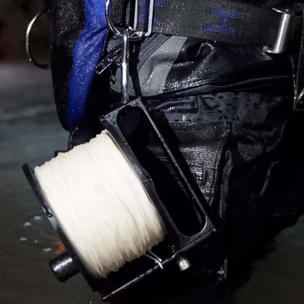 Halcyon Pathfinder 800 reel clipped to a diver's harness